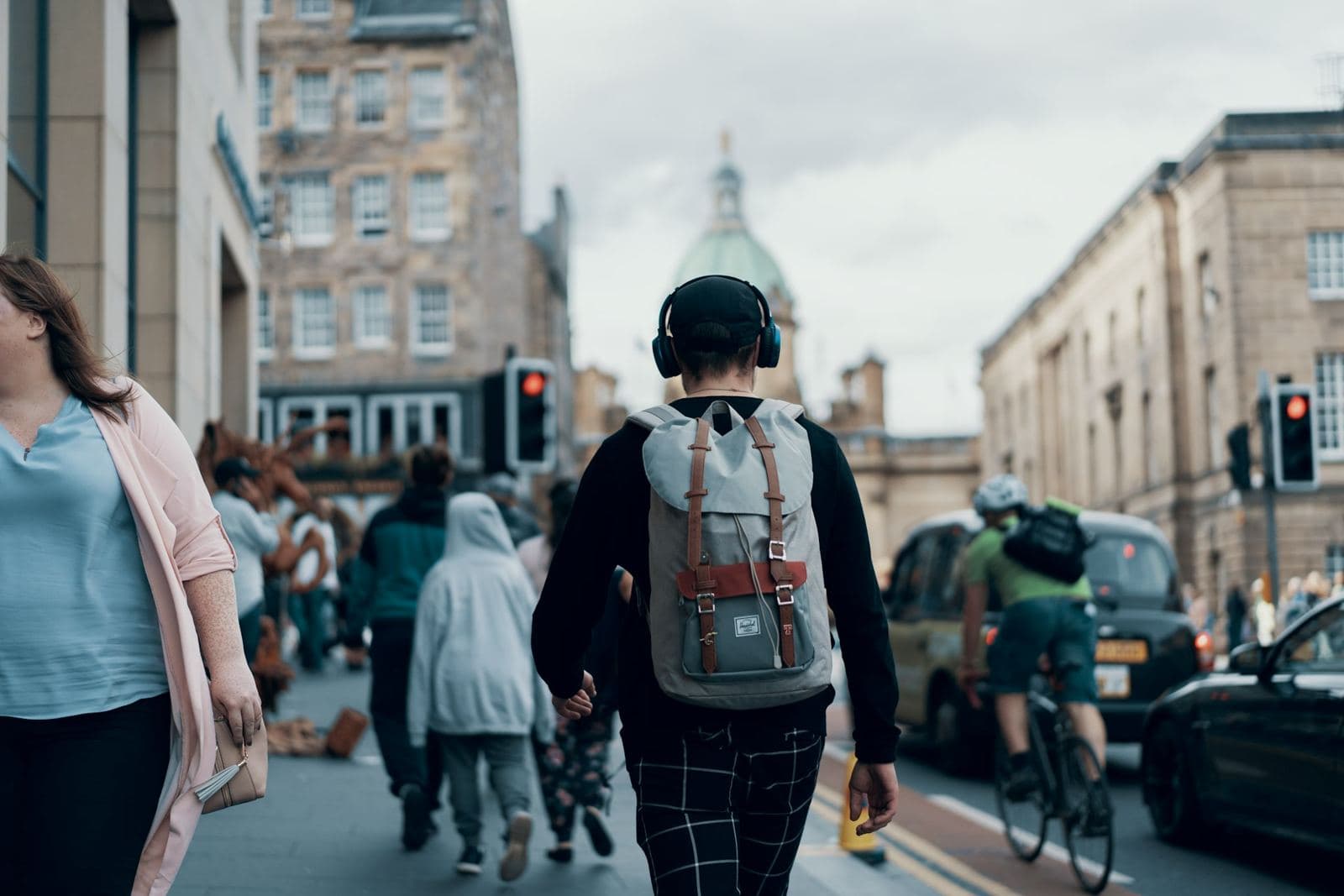 Crowds walking down the Royal Mile in Edinburgh during festival season. Photo by Ross Sneddon on Unsplash (unsplash.com/@rosssneddon)